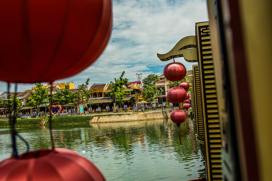 An Hoi Bridge stretches over the sleepy Thu Bon River in Hoi An